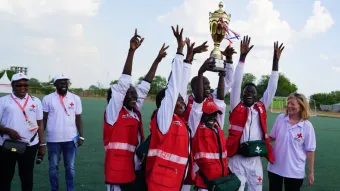 Juba Branch volunteers raising their trophy